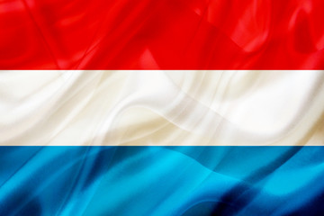 Luxembourg country flag on silk or silky waving texture