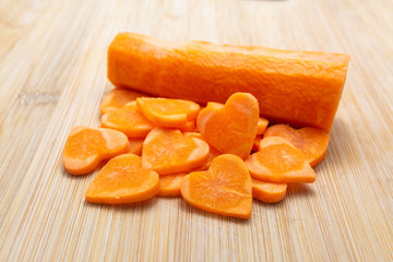 Naklejka na ściany i meble Sliced carrot on cutting board preparated for cooking.