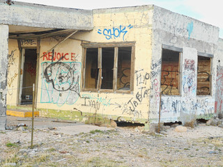 an old house ruin with graffiti