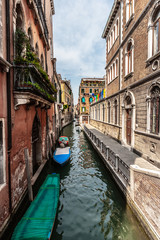 Fototapeta na wymiar Venice canal with gondolas in summer sunny day. Italy.