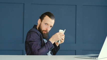 Greedy worried man counting dollar banknotes. Economy money saving and management tips concept.