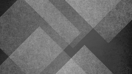 Abstract black and white background with large geometric triangle and diamond pattern. Elegant dark gray color with textured light shapes and angles in modern contemporary design.