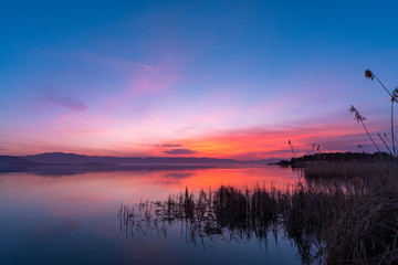 Fototapeta na wymiar Beautiful sunrise on the lake. Armenia Sevan lake