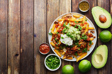 mexican carne asada fries in copy space composition shot from birds eye view