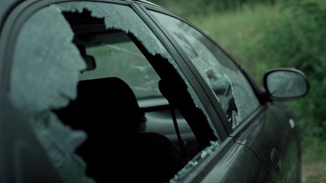 Sniper performs a secret mission. Fighting Shooting from the car. Slow Motion. 4K. UHD.