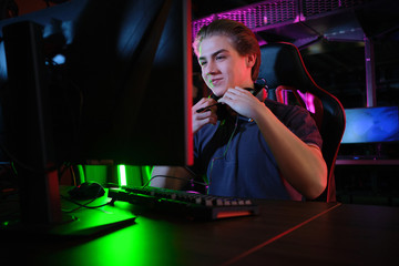 Cyber sport. Team play. Professional cybersport player training or playing online game on his PC