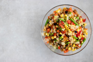 Mix frozen vegetables in a glass bowl. Concept of vegetarianism and healthy eating.