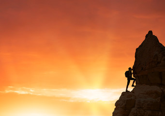 silhouette of successful climbing woman in mountains Concept of concept of motion motivation inspiration at beautiful sunset