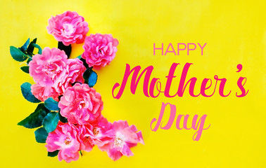 Yellow Mothers Day background with pink roses.