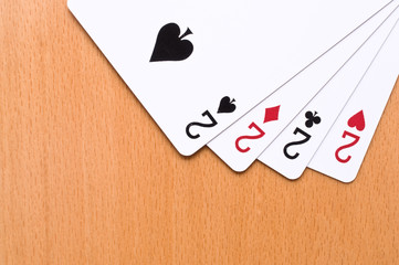 Playing cards on the wooden table.
