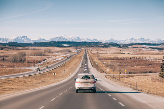 White Vehicle Driving to The Mountains