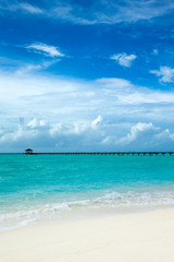 Obraz premium Beautiful tropical Maldives island with beach , sea , and blue sky for nature holiday vacation background concept