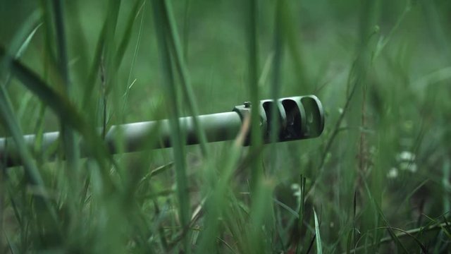 Shot in Super Slow Motion. Muzzle brake. Sniper Rifle. Extreme close-up. 