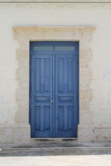 Fototapeta na wymiar blue wooden front door without a door knob