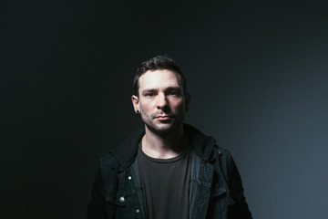 Serious man in dark room