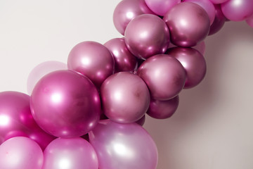 purple balloons of different sizes for the decoration of the holiday