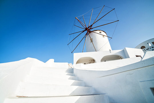 Windmill at sunset Santorini Greece