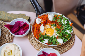 Shakshuka, Fried Eggs in Tomato Sauce on the Table