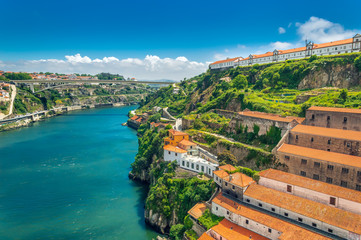 Fototapeta na wymiar Porto, Portugal: hills of Vila Nova de Gaia and wine cellars over Duoro river