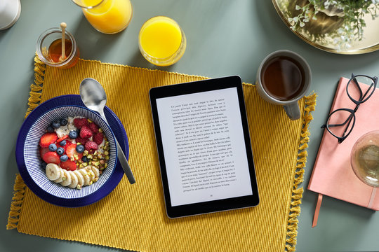 Still life of home reading at breakfast.