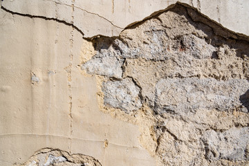 Broken brick wall in the cracks
