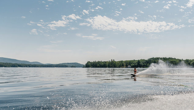 Child Waterskiing on Lake