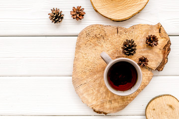 Tree stumps, coffee and cones for presentation background top view copy space