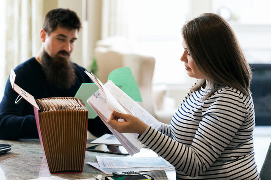 Taxes: Couple Going Through Tax Return Information