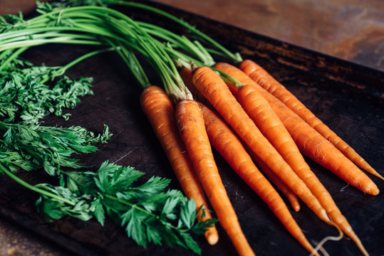 Close up of freshly picked carrots in a tray