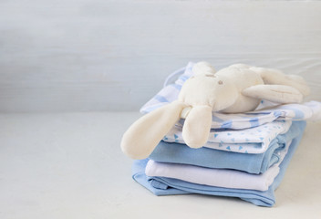 Fototapeta na wymiar Baby clothes for newborn boys, in blue tones.