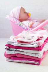Baby clothes for newborn girls in pink colors.