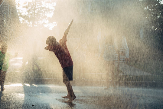 Kid having fun in rain