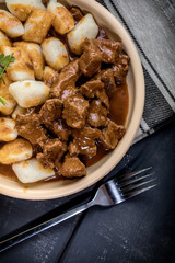 Beef stew with potatoes dumplings.