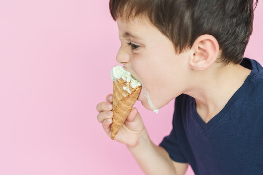 A Boy With Dripping Ice Cream Cone