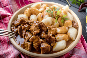 Beef stew with potatoes dumplings.