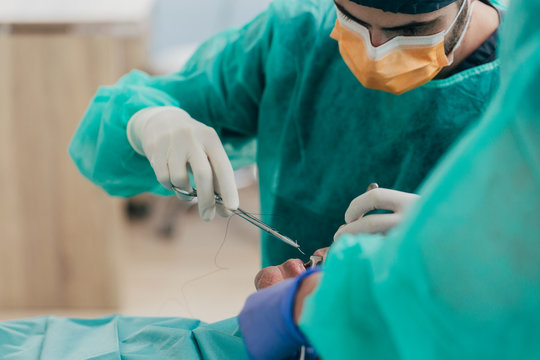 Dentist working on elderly man teeth