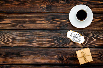 design for Father Day celebration party with gift box and coffee on wooden background top view mock up