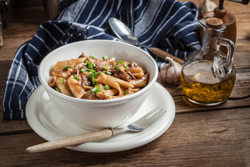 Pasta penne with pork sauce.