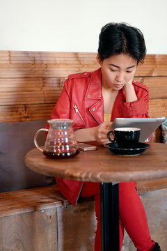 Woman reading in cafe