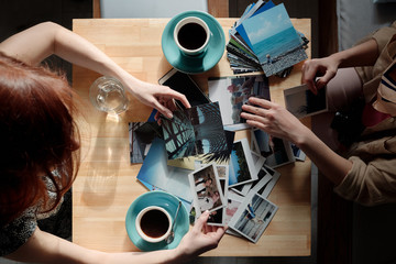 Friends looking through vacation photos