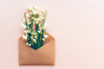 snowdrop flowers in paper envelope