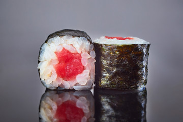Classical roll sushi with tuna on black background for menu. Japanese food