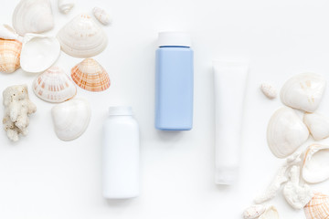 Dead Sea cosmetics with natural ingredients on white table background top view