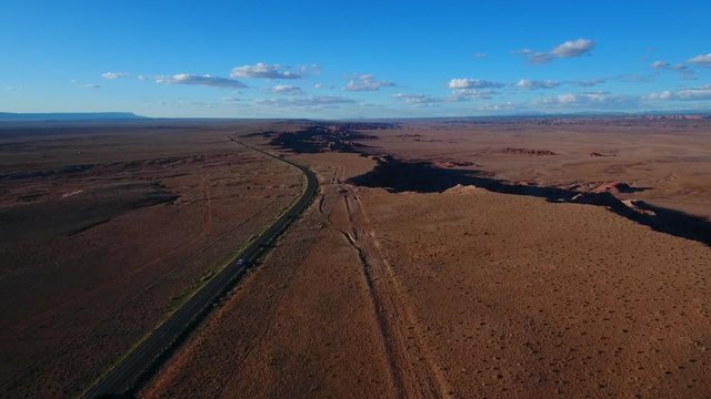 Desert road along the egde of a steep cliff