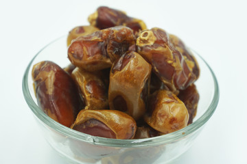 Kurma or dates fruits isolated on white background