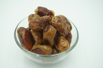 Kurma or dates fruits isolated on white background