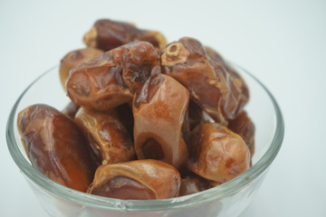 Kurma or dates fruits isolated on white background