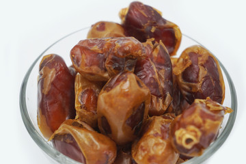 Kurma or dates fruits isolated on white background