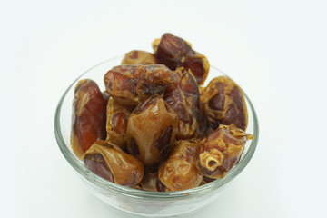 Kurma or dates fruits isolated on white background
