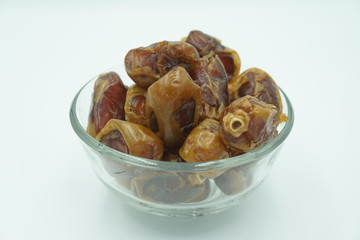 Kurma or dates fruits isolated on white background